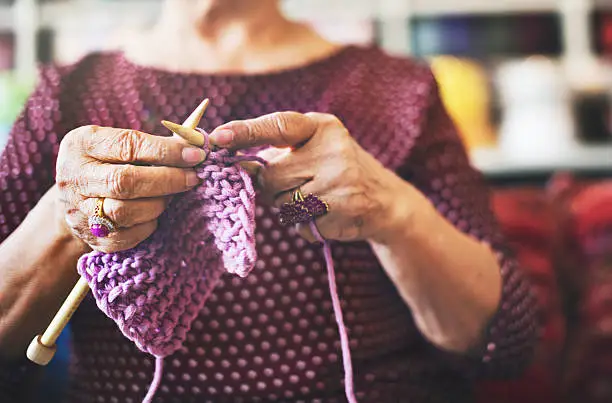 elderly woman knitting, memory games for seniors