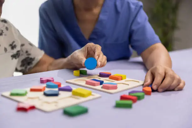 memory games for seniors, senior and caregiver playing puzzle game